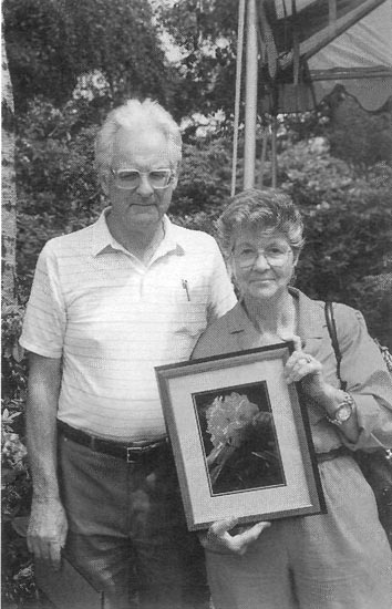 Gordon and Vern Finley accepting prize 
for 'Burnaby Centennial'.