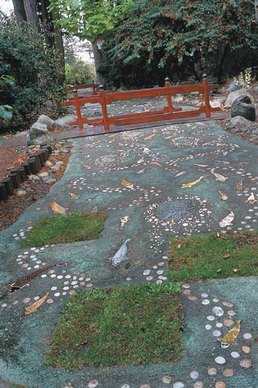 The dry stream with ceramic koi.