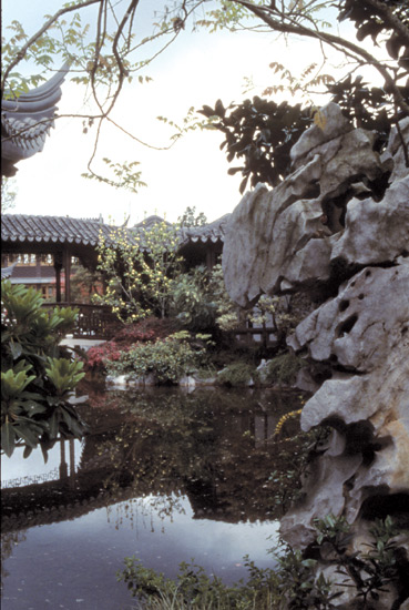 Reflected scene near Pavilion showing
typical upturned roof and phantasmagoric rock