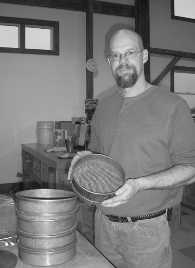 Joe Inman with sieves for
separating seed from chaff.